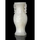 A WHITE JADE ‘TAOTIE MASK’ JOYSTICK HOLDER OF ARCHAISTIC GU SHAPE CHINA, QING DYNASTY Of