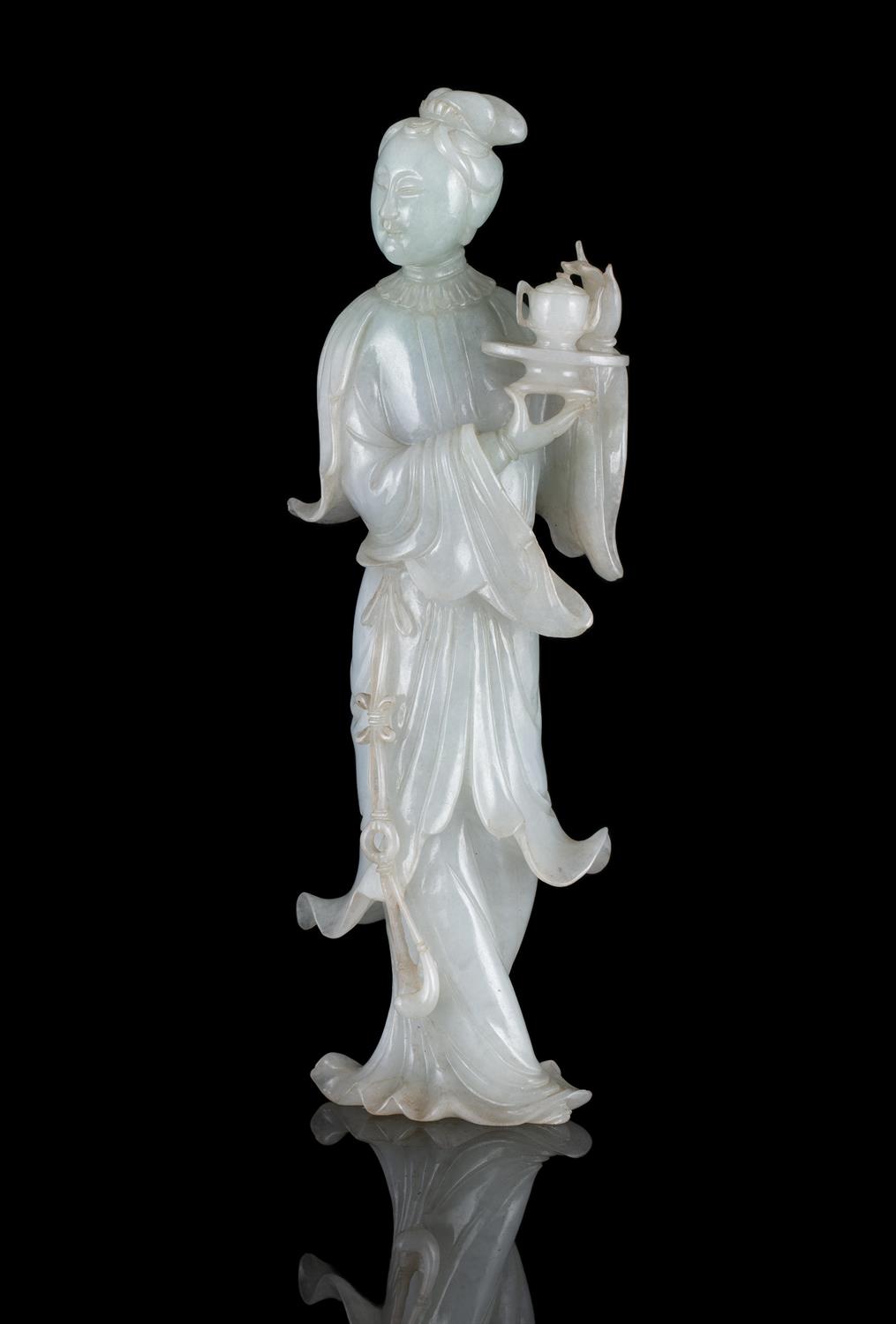 A FINE JADEITE JADE CARVING OF A STANDING MEIREN CHINA, CIRCA 1900-1930 The stone of white tone with