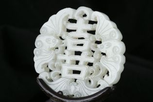 A RETICULATED JADE ‘HAPPINESS - XǏ - 喜’ PENDANT / PLAQUE CHINA, QING DYNASTY Of circular shape,