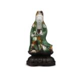 AN EGG AND SPINACH MOLDED BISCUIT PORCELAIN FIGURE OF A GUANYIN CHINA, QING DYNASTY, POSSIBLY KANGXI