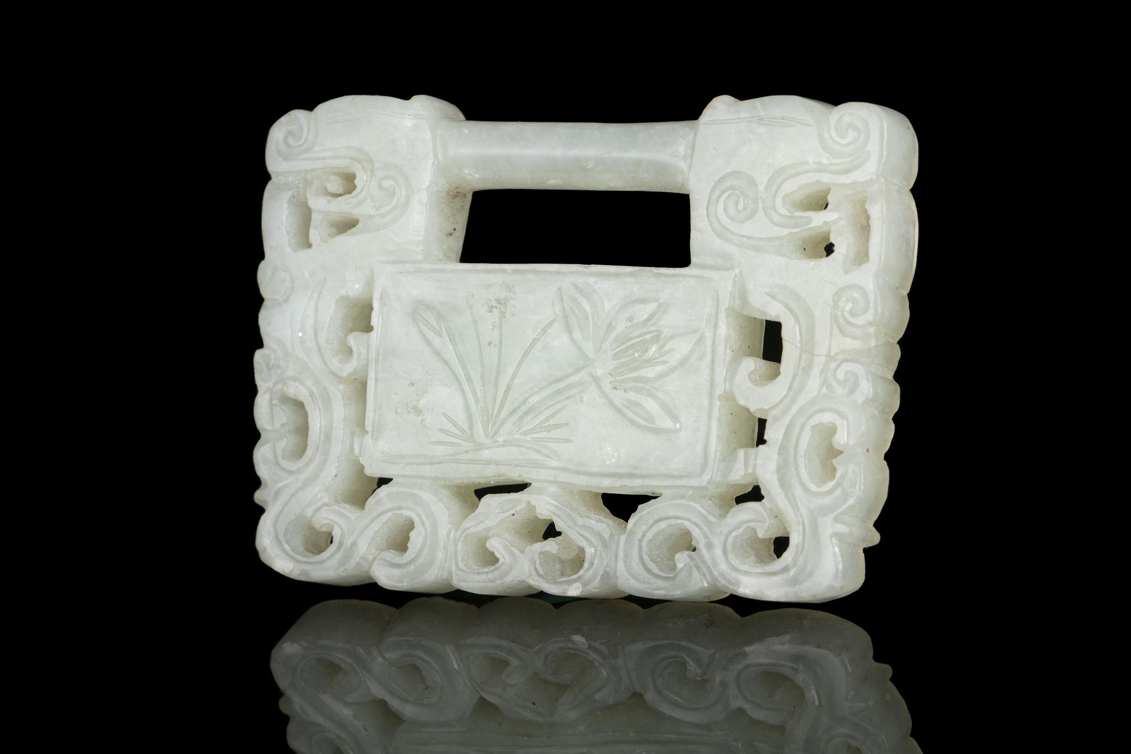 A JADE ‘KUI DRAGONS AND LOTUS’ PADLOCK / PLAQUE / PENDANT CHINA, QING DYNASTY Of rectangular