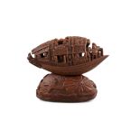 AN OLIVE PIT CARVING OF A 'PLEASURE BOAT' IN THE MANNER OF GUCHENG 谷生作 China, Late Qing Dynasty to