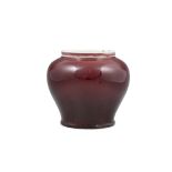 AN OXBLOOD / FLAMBE GLAZED BALUSTER PORCELAIN VASE CHINA, POSSIBLY LATE QING DYNASTY It rests on a