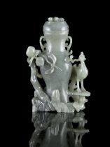 A JADE CARVING OF A LIDDED VASE TOGETHER WITH A PHOENIX CHINA, LATE QING DYNASTY Carved out of a