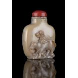 AN AGATE ‘COWHERD AND WATER BUFFALO’ SNUFF BOTTLE CHINA, 20TH CENTURY Resting on a short ring