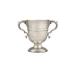 AN IRISH PROVINCIAL SILVER TWO-HANDLED LOVING CUP, struck 'STERLING' with acanthus leaf capped