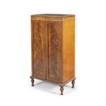 AN EDWARDIAN STYLE MAHOGANY TWO DOOR CABINET, with decorated brass finishes. 99cm high, 51cm wide,