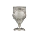 AN IRISH SILVER GOBLET, Dublin c.1787, mark of Matthew West, embossed and chased with Bacchus,