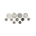 A COLLECTION OF SILVER COINS including a 1964 Kennedy half dollar (mounted); a 1914 half crown,