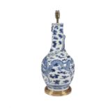 A BLUE AND WHITE ORIENTAL BALUSTER SHAPED VASE, the body wrapped with a four claw dragon amongst