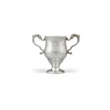 AN IRISH SILVER TWIN HANDLED CUP, Dublin c.1773, mark of Matthew West, the plain ovoid body with