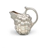 AN ITALIAN SILVER WINE JUG, in the form of a bunch of grapes and branch for the handle,