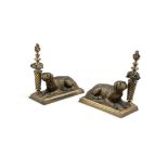 A PAIR OF GILTMETAL DOOR STOPS, modelled as recumbent hounds, resting beside spiral turned column