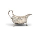A LARGE GEORGE III IRISH SILVER SAUCEBOAT, Dublin c.1770, maker's mark rubbed, of helmet form with