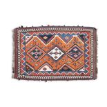 A KASHGAI / QASHQAI RED GROUND CARPET, the central field with three interlinking medallions,