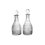 A PAIR OF IRISH REGENCY MALLET-SHAPED HALF-SIZE DECANTERS, flat-cut and heavy gauge,