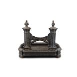 A LARGE VICTORIAN BLACK PAINTED CAST-IRON BOOTSCRAPER, formed as knobbed gothic columns on a