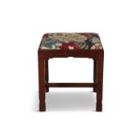 AN IRISH MAHOGANY FRAMED STOOL BY JAMES HICKS, of Pembroke St. Dublin, stamped, with square drop-in