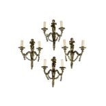 A SET OF FOUR FRENCH GILT-BRASS WALL SCONCES WITH CHERUBS (4)