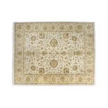 A ZIEGLER PATTERN WOOL RUG, the rectangular field woven with intertwined tendrils and flower heads