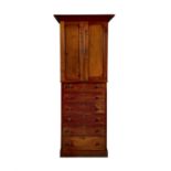 A VICTORIAN STAINED OAK UPRIGHT CABINET, with moulded cornice above twin fielded panel doors on a