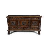 AN 18TH CENTURY STAINED OAK RECTANGULAR COFFER, the plain three plank top with moulded rim above a