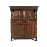 AN 18TH CENTURY STAINED OAK COURT CUPBOARD, with overhanging moulded cornice above two arch top
