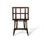 A REGENCY ROSEWOOD FOLIO STAND, the adjustable frames on ratchet supports and on double downswept