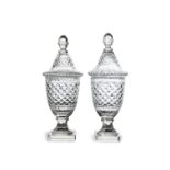 A PAIR OF IRISH STYLE URN SHAPED CUT GLASS VASES AND COVERS, the tall covers with acorn finials and