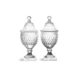 A PAIR OF FLAT-CUT URNS AND COVERS c.1790, probably Irish, the domed covers with knobbed finials,