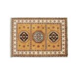 A KONYA ORANGE GROUND RUG, Turkey, the central reserve divided into three sections,