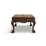 AN IRISH CARVED MAHOGANY STOOL, 19TH CENTURY, in the 18th Century style, the shaped aprons