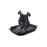 A VICTORIAN BLACK PAINTED CAST IRON BOOTSCRAPER, in the form of a lyre, over shaped rectangular