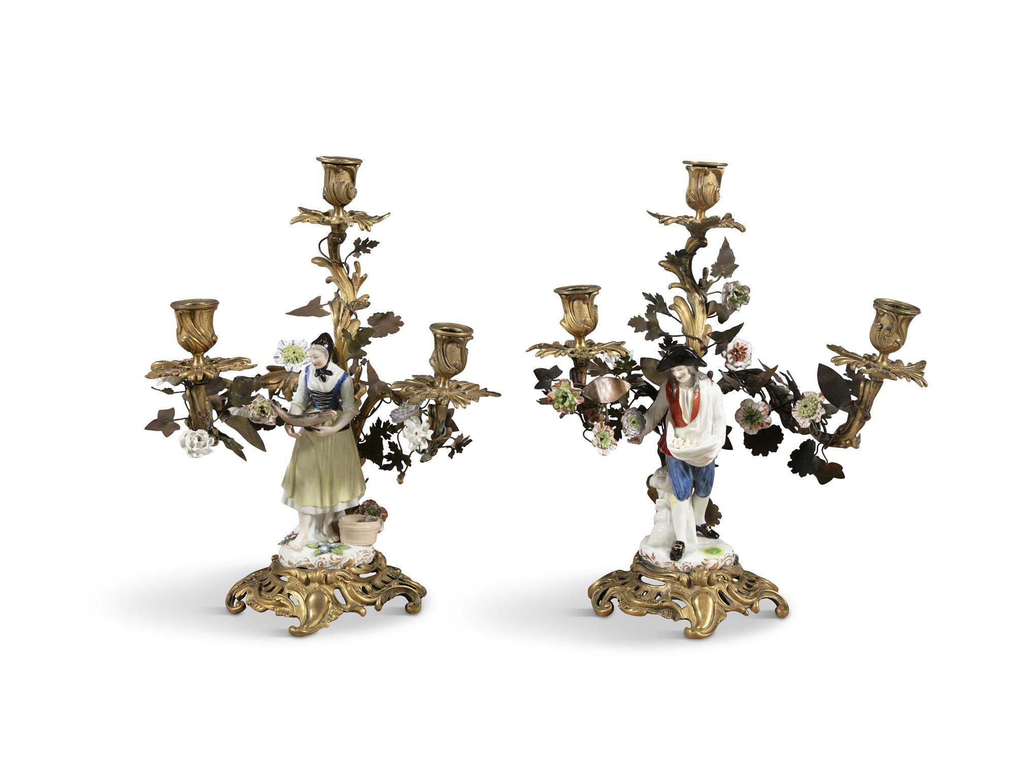 A PAIR OF GILDED METAL AND PORCELAIN FIGURAL CANDELABRA, French 19th Century, in the rococo taste,