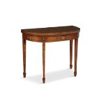 A GEORGE III STYLE PAINTED SATINWOOD FOLDING TOP CARD TABLE, of shaped bowfront rectangular form,