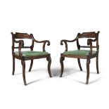 A PAIR OF IRISH REGENCY MAHOGANY OPEN LIBRARY ARMCHAIRS, the reeded frames with incurved scroll
