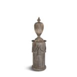 A 19TH CENTURY CARVED PINE PEDESTAL, of demi-lune shape, with stop-fluting and classical swags,