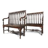 A MATCHED PAIR OF 19TH CENTURY CARVED OAK BENCHES, in the Gothic style, the arched gallery backs