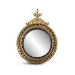 A GEORGE IV GILTWOOD CIRCULAR CONVEX MIRROR, the beaded frame surmounted by a final of tied