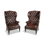 A PAIR OF 19TH CENTURY MAHOGANY FRAMED WINGBACK AMRCHAIRS, upholstered in close nail wine leather,