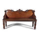 A VICTORIAN MAHOGANY HALL BENCH MID 19TH CENTURY, with raised scrollwork panel back and sides,