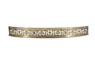 A GEORGE III PIERCED BRASS BOW FRONT FENDER, c.1790, with pierced fluted rim, decorated with urns