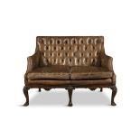 A 19TH CENTURY GEORGE III STYLE MAHOGANY FRAMED TWO SEATER LIBRARY SOFA, with button back and