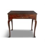 AN IRISH MAHOGANY GAMES TABLE C. 1740, the reversible moulded top with mahogany counter holders,