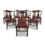 A SET OF SIXTEEN GEORGE III DINING CHAIRS, with carved pierced splats, fourteen and two carvers