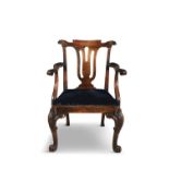 A GEORGE II MAHOGANY FRAMED OPEN ARMCHAIR, the scroll back top, above a pierced vase shaped splat,