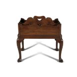 A GEORGE III MAHOGANY BOTTLE TRAY ON STAND, of rectangular form, with eight open compartments,