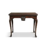 AN IRISH GEORGE III FOLD TOP MAHOGANY TEA TABLE, the rectangular top carved with interlinked