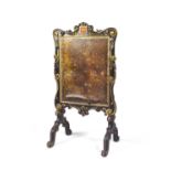 A REGENCY EBONISED TIMBER AND PARCEL GILT FIRE SCREEN, of rectangular form, the frame surmounted