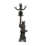 A LARGE SWISS 'BLACK FOREST' CARVED LINDEN WOOD BEAR HALL STAND, 19th century, in the form of a